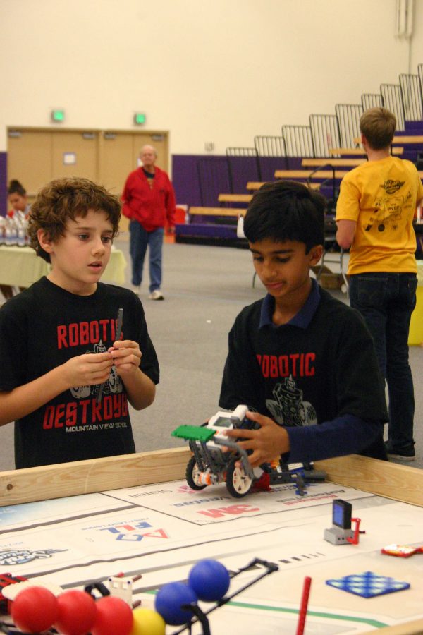 War Machine: Two students from Mountain View School program their robots and compete for the highest score. Twenty eight teams from across California competed in the First Lego League Robotics Qualifying Tournament.
Photo by Alli Westerhoff - Staff Photographer