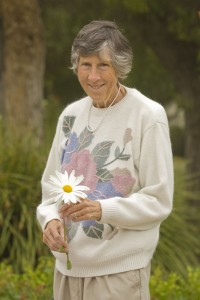 With her winning smile: Collins happily poses in nature. Photo courtesy of Karin Grennan 