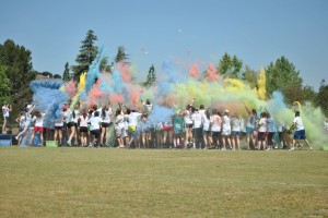 Taste the rainbow: (Top) A final color splashing ended the 5k. (Below) Participants are decorated as they run. Photos by Lauren Rote - Staff Photographer