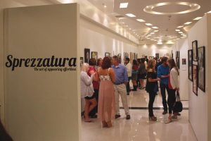 A grand display:  (Left) Students and faculty mingled at the opening on Saturday. (Right) Each senior had a section of the gallery devoted to their art. Photos by Stephen Orth - Staff Photographer