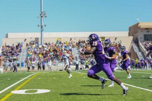 Showing his stuff: Senior Wayne Chapman debuted with the Kingsmen last Saturday at William Rolland Stadium. He finished the game with 143 yards rushing on 14 attempts and one reception for eight yards.  Keith SparksPhoto by Melina Esparza - Photo Editor