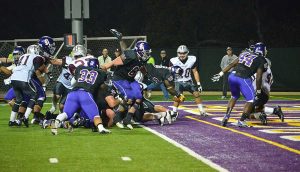 Leap of Faith: Wayne Chapman leaped over the pile for the Kingsmen's lone touchdown of the ballgame. Chapman finished the game with 57 yards rushing on 17 attempts. He also recorded 2 receptions for 21 yards.  Photo by Arianna Cook - Staff Photographer