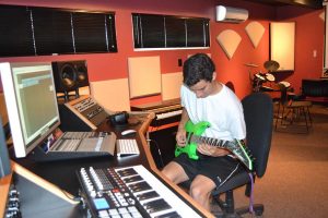 In with the new:  Freshman music major Reid Holmes tests his skills in the newly renovated music production lab.  Photos by Jessica Aparicio- Staff Photographer