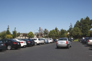 Circling the lot:  Campus safety employee Hunter Young said she hears complaints about a lack of parking spaces on a daily basis. Young said he thinks that carpooling might be an effective solution.   Photo by Kine Rossland - Staff Photographer 