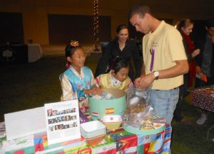 Global getdown: Attendees of different backgrounds learn about various cultures at last year’s World Fair.  This year, the celebration will be on Nov. 13 from 6-8 p.m. at the University Plaza.   Photo courtesy of Linda Boberg