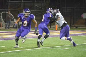 Running away with it: Chris Cabrera celebrated his senior night with four tackles and one interception. Photos by Arianna Cook - Staff Photographer