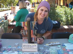 Fair trade: Look for students wearing colorful Pura Vida bracelets around campus. Chances are they were purchased from Pura Vida campus representative Kassidy Hansen. Photo by Rebecca Bomfim-  Staff Photographer