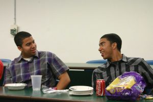 “I have a dream” for 100: Sophomores Eric and Evan Carthen discuss their answers to the “Jeopardy!“ questions on Feb. 21 in Peters Hall.  Photo by Kayla Gamache- Staff Photographer