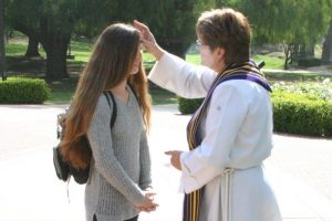 Traveling Ashes: Campus pastors Reverends Scott and Melissa Maxwell-Doherty went to various locations on March 5, to give ashes to students participating in Ash Wednesday rituals.  Photos by Haakon Asker- Staff Photographer