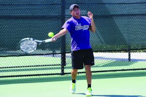 Straight dominance: Moises Cardenas won both his singles (7-5, 3-6, 6-3) and doubles match (8-2 with partner Fergus Scott) on April 5 at Poulson Tennis Courts.  Photo by Isabella Del Mese - Staff Photographer