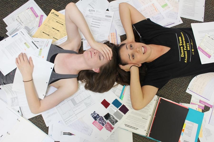 Cutting paper: Seniors Alex Nadell and Kayla Peralta become engulfed in the paperwork required to run the CLU Dance Team.  
Photos by Anna Coulson- Staff Photographer