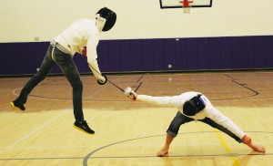 En garde!: Seniors Andrew Pineda (left) and Hayden Malloch (right) catch some air during their sparring session. Photos by Paulyn Baens - Staff Photographer