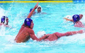 Physical play: (Left) Senior attacker Nathan Ortega looks to put a shot past the goalie. (Right) Sophomore utility Camron Hauer, who scored one of Cal Lutheran’s 20 goals against Valley College, finds an open teammate. (Bottom) Sophomore attacker Tyler Graper fends off his defender and calls for the ball. Photos by Tina Abbaszadehw - Staff Photographer