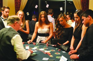 Blackjack: Cal Lutheran students test their luck at the table at North Ranch Country Club, Friday, Oct. 18. Photo by Rikke Bovre - News Editor