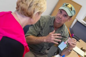 Talking about their experience: A veteran talked to a woman about veterans during the Veterans Entrepreneurship Institute in early 2014. Photo by Karin Grennan - Media Relations Manager