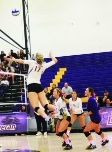 Cutting paper: Sophomore outside hitter Michelle Lawrence goes up for the spike. Lawrence had 11 kills in the win against Redlands. Photo by Paulyn Baens - Staff Photographer