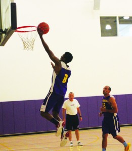 Senior guard and team captain Arik Smith drives to the hoop during practice. Smith led the Kingsmen in scoring last year averaging 16.8 points per game.