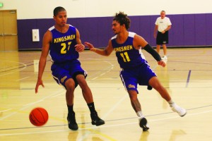 Senior guard Martin Flowers practicing his ball handling against junior guard Lanaki Apele.