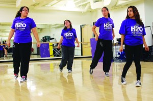 Break it down: (Left to right) Senior Fransheska Barrios, sophomore Sari Terrazas, junior Justina Posadas and sophomore Marbella Jiminez strut their walks during their rehearsal of their World's Fair performance piece. Photo by Genesis Rodriguez - Staff Photographer