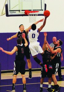 Strong finish: Senior guard Arik Smith goes up for a layup over several Chapman defenders in the Kingsmen’s victory against the Panthers.