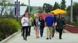 Show me around:  A tour full of parents of prospective honor students made their way through campus with Presidential Host Karly Loberg.
