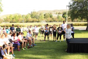 Saving Innocence case manager Sara Elander speaking to the runners before the race.  