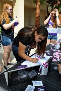 Freshman, Marissa Holguin signing up to join Her Campus, an online magazine for women at Cal Lutheran to find news on upcoming events, fashion, lifestyle, and more. Photo by Karina Hernandez - Staff Photographer