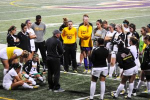 Head coach Frank Marino talks to his team following a win against Chapman.  Photo by Eric Duchanin - Staff Photographer