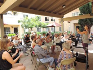 Teaching Zumba: Students from Cal Lutheran joined seniors at Artria Senior Living for an afternoon of Zumba dance. Photo by Mary Callaway - Senior Writer