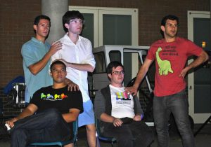 Seasoned improviser, Eric Carthen with newcomers Matt Waxman, Grant Escandon, Ryder Christ, and Frankie Manes. The improv troupe rehearsed outside of Overton hall for their outdoor performance, or what they called "Outdoorprov. " Photo by Karina Hernandez - Staff Photographer