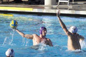 Senior attacker AJ Franklin attempts to put a shot past a Claremont-Mudd-Scripps defender.  Photo by Brady Mickelson - Staff Photographer