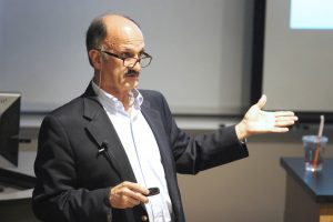 Crisis effects: Professor Jamshid Damooei speaking at the “Economic Impact of the Current Middle East Refugee Crisis: Separating the Myth from the Legend.” The event focused on the European refugee crisis in Syria and took place in Richter Hall. Photo by Karina Hernandez  - Staff Photographer