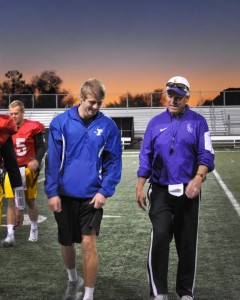 Senior quarterback Mike Butler (left) talking to offensive coordinator and quarterbacks coach Clay Richardson after practice. Despite being injured, Butler has been a key leader for the Kingsmen from the sidelines. Photo by Eric Duchanin - Staff Writer