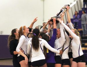 The Regals celebrate with their NCAA DIII Regionals trophy after they defeat Washington-St. Louis. 