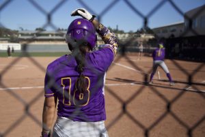 Cal Lutheran senior Blake Lewis prepares to bat next. Photo by Amanda Marston - Staff Photographer