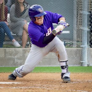 Junior catcher, Eddie Villegas, lays down a bunt moving runners up as well as making it safely to first base. Villegas had two hits against the California Institute of Technology Beavers.  Photo by Roman Valenzuela - Staff Photographer