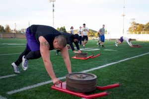 While most of the university is fast asleep, the football team is up early working hard for next season in hopes of having better results. Photo by Eric Duchanin - Senior Photographer