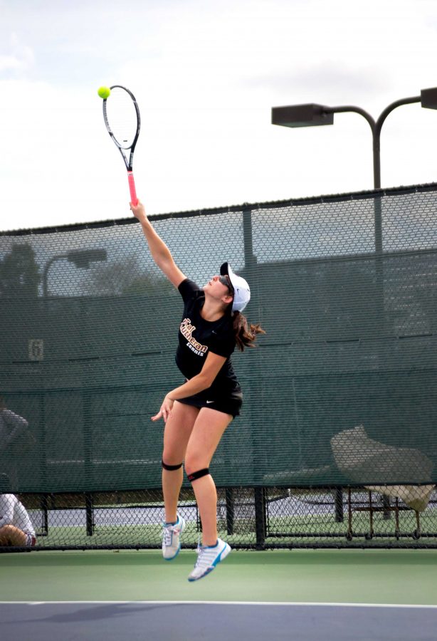 Junior Rebecca Gold serves in her doubles match against Vassar. 
Photo by Eric Duchanin - Senior Photographer