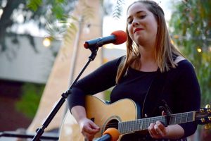 Junior and singer/songwriter Katrina Petty puts on a performance at the Cal Lutheran Battle of the Bands. Photo by Roman Valenzuela - Staff Photographer