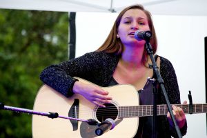 Nicole Campbell got the Cal Lu Palooza festivities started off by singing one of her original songs.  Photo by Roman Valenzuela - Staff Photographer