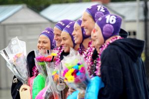 The Regals water polo team honored seven seniors April 9. (L-R) Maggie Kurzeka, Darby Schuett, Lauren Shackelford, Tatiana McCuaig, Amanda Jones, Gina Merry and Bailey Likewise. Photo by Jackie Rodriguez - Staff Photographer