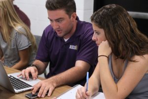 Collaboration: Sophomore Senator Nick Steinwender and junior Michaela Kennedy research their proposals and benefits of their resolutions. 