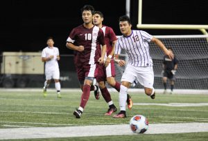 Making moves: Junior midfielder Jaime Alvarado plays a close game against the reigning SCIAC champions Redlands defenders in SCIAC home opener. Photo by Morgan Mantilla--Staff Photographer