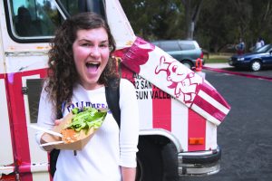 Fair Festivities: Petra Rikertsen enjoying the Crepe'n Around food truck at the 2016 Study Abroad Fair. Photo by Morgan Mantilla - Staff Photographer 