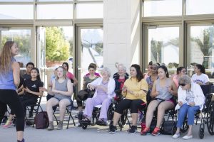 Smiles on both students' and seniors' faces are shown as everyone mimics the moves of Zumba instructor Stacy Gross. Photo by Kaelani Medina - Staff Photographer 