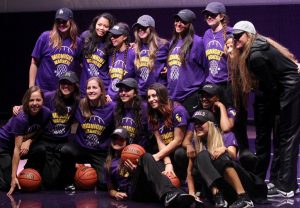 The women's basketball team poses for a team photo after winning the dance competition Photo Credit--Jackie Rodriguez Photo Editor