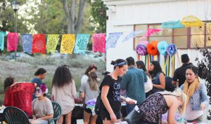 Honoring tradition: Crafts at Dia de los Muertos included face painting, sugar skull decorating, tissue paper flower making, bingo and entering in a raffle to win prizes from the Latin American Student Organization. 