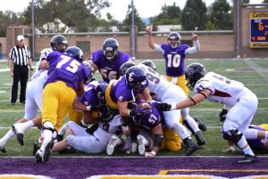 Pushing through: Junior running back Chris Beeson had two rushing touchdowns and got the Kingsmen 57 yards on the ground.  Photo Credit--Eric Duchanin Staff Photographer