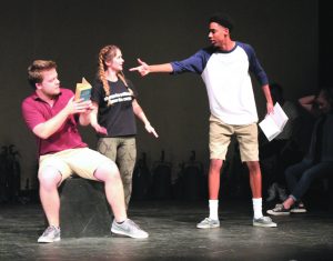 Improv Issues: The scene heats up as “ex-husband” Lipps pulls a finger gun on Young and her new husband Madera. (L to R) Mark Madera, Lane Young, and Cristian Lipps.   Photos by Morgan Mantilla- Staff Photographer 