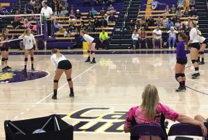 Looking on: Heach Coach Kellee Roesel looks on at her team as they set up for their next play. (Left-Right) No. 8 Jamie Smith, No. 10 Carly Rose Howard, No. 18 Molly Holloway, No. 11 Nicki Tetherow, No. 17 Michelle Lawrence and No. 4 Amanda Roberts. Photo Credit--Makenna Pellerin Staff Photographer